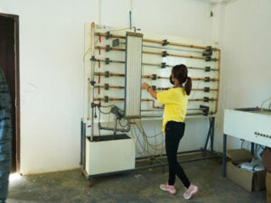 Student performing experiment in Fluid Mechanics Lab